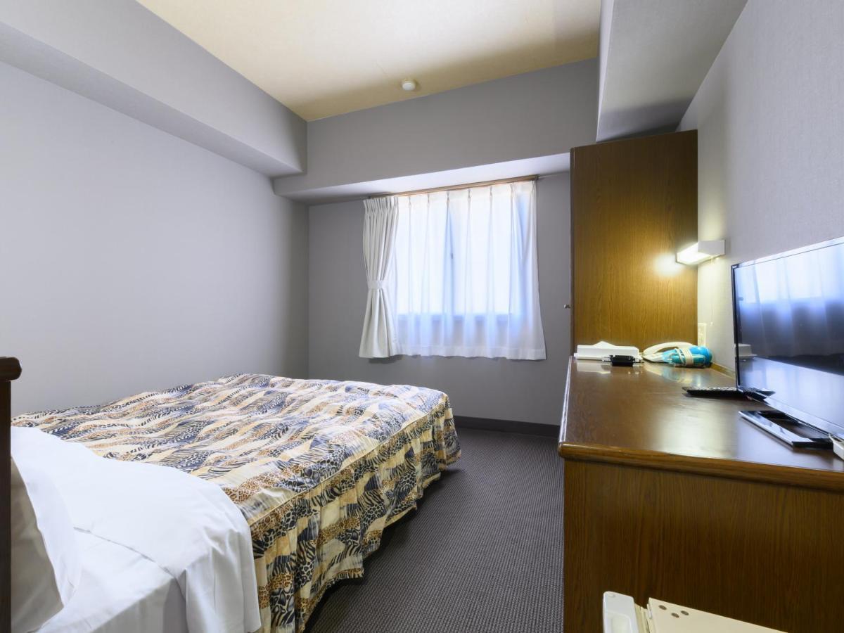 Tabist IWATA Station Hotel Exterior foto