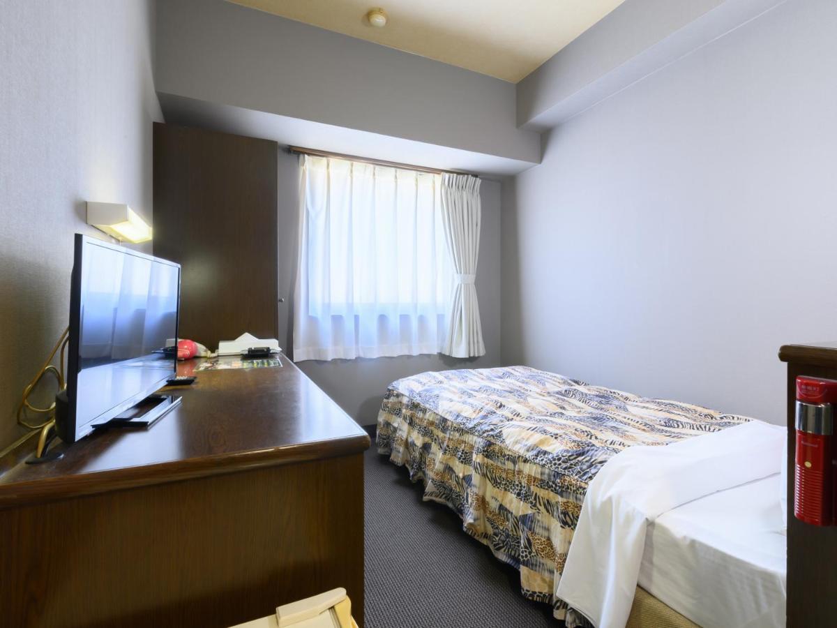 Tabist IWATA Station Hotel Exterior foto